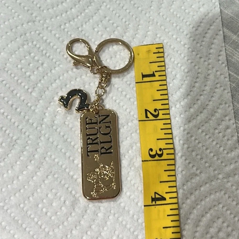 True Religion Gold and Black Keychain NEW